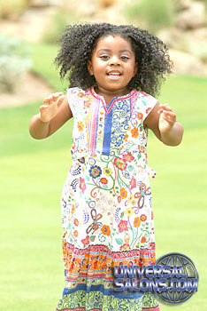 Little Girl Jumping with Tight Afro Curls