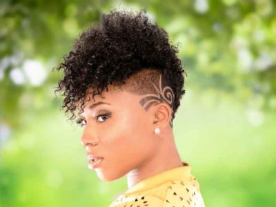 Bold Mohawk Hairstyle with Tight Bangs and Tapered Sides