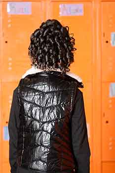 Back View: Model in Front of Lockers wearing Curly Bob Hairstyle