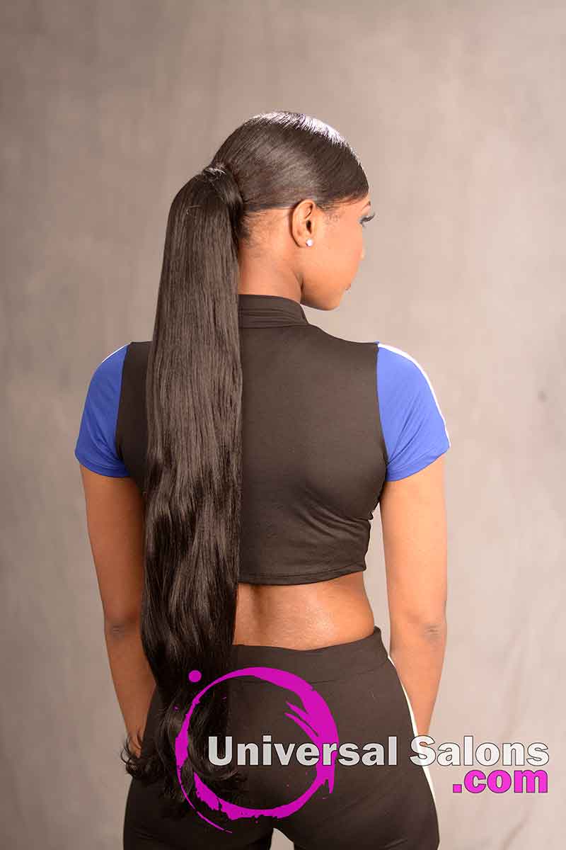 The Back View of a Deep Side Part Ponytail Hairstyle