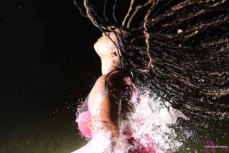 Model Splashed With Water Wearing Long Goddess Locks Hairstyle With Accents