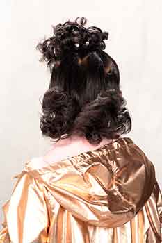 Back View: Model With a Curly Bun Hairstyle