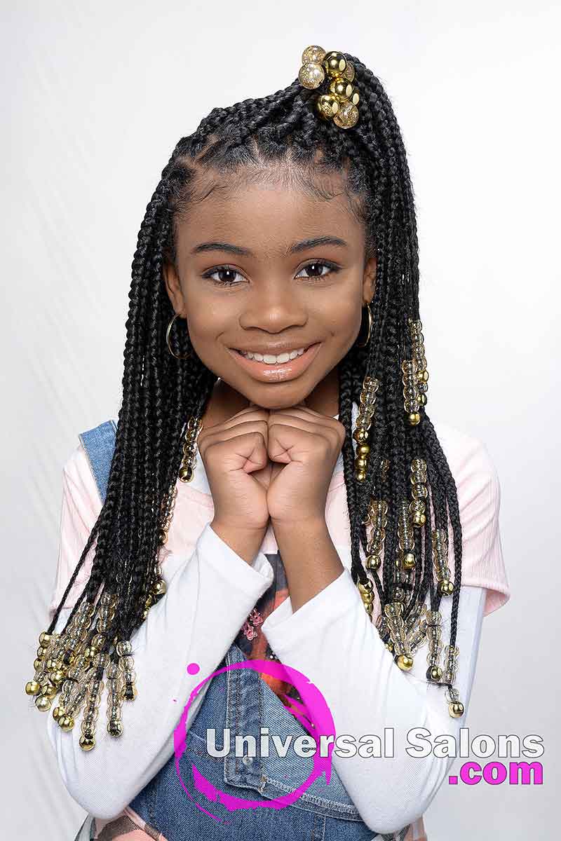 Model Smiling With Kid's Knotless Box Braids With Beads